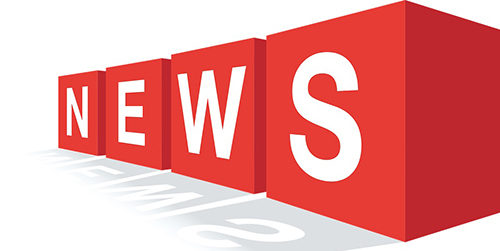 News lettering written in white on four red cubes (one cube per letter), adopting a perspective in which the N is furthest and the S closest. In addition, the cubes cast a shadow to the front.